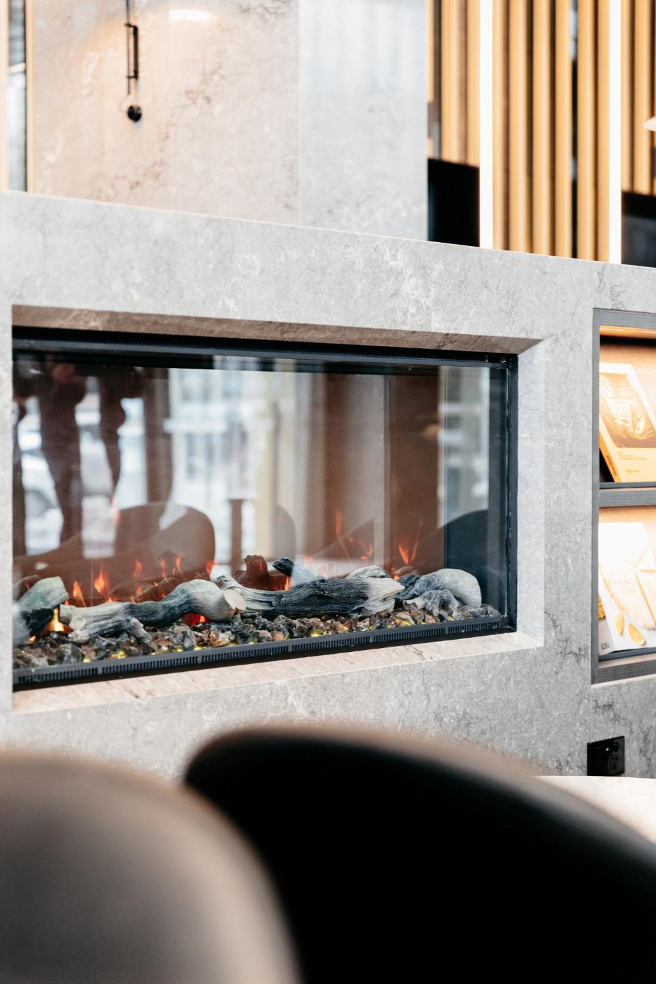 Meriton Suites Canberra Exterior photo A fireplace with ethanol fuel