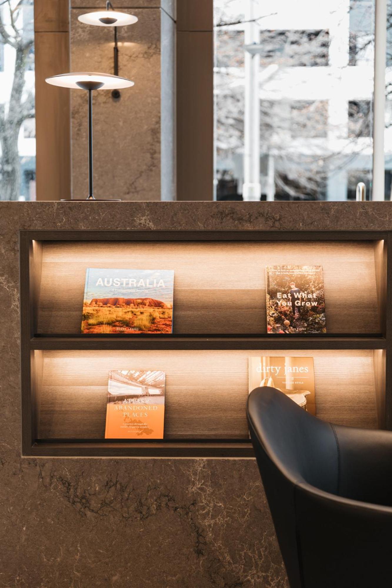Meriton Suites Canberra Exterior photo A selection of magazines at the lounge