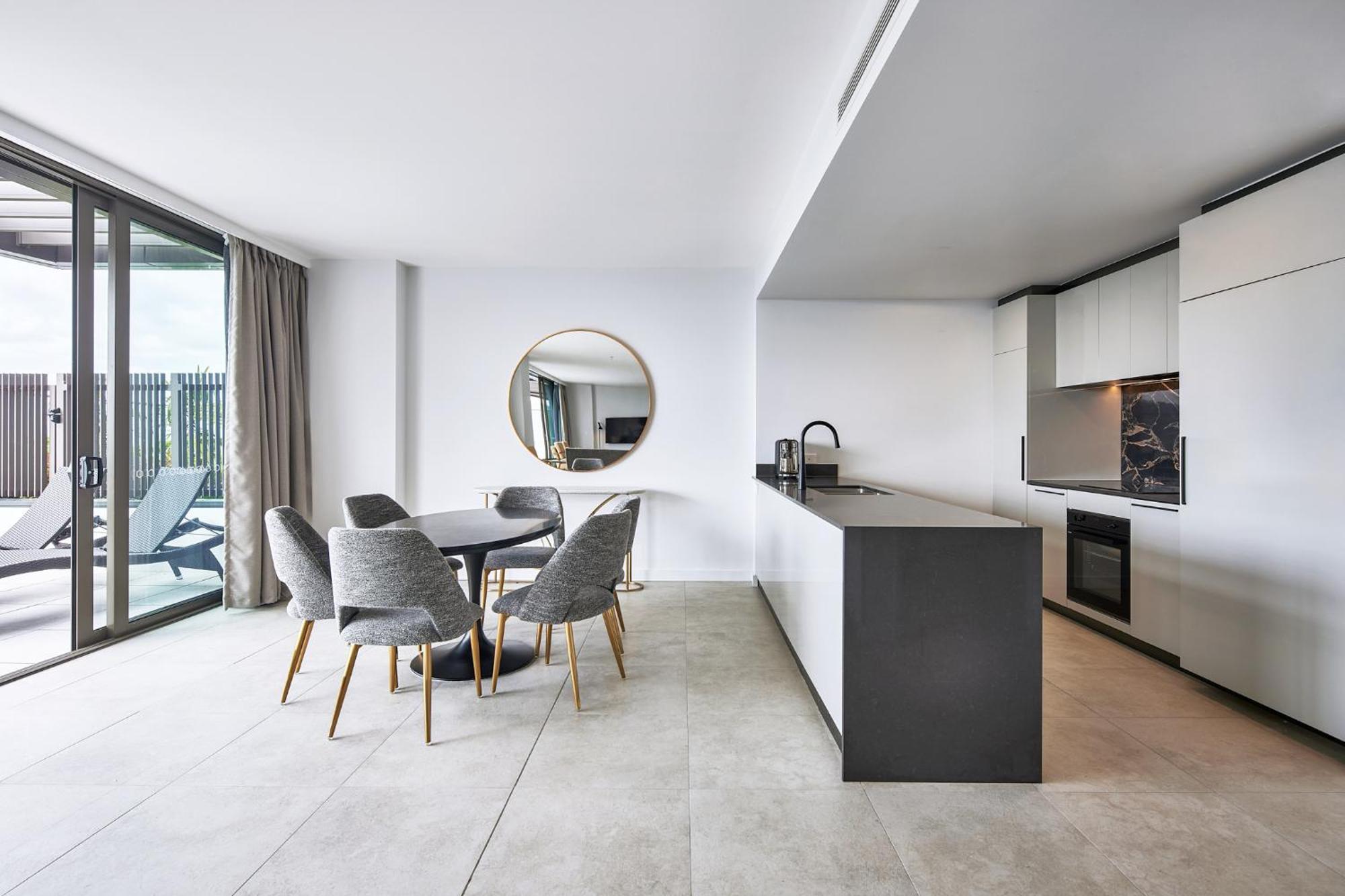 Meriton Suites Canberra Exterior photo The kitchen and dining area of a typical apartment