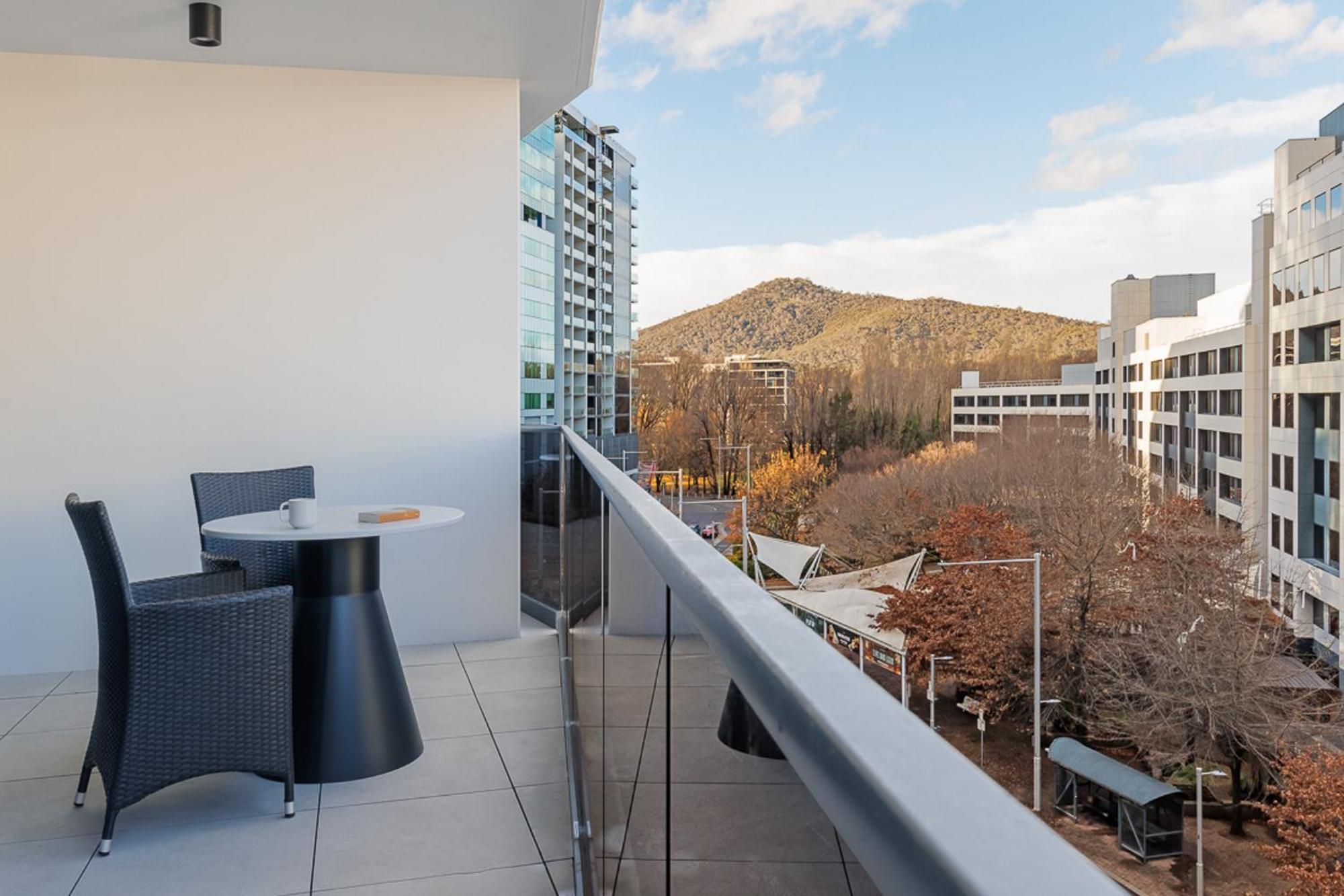 Meriton Suites Canberra Exterior photo A balcony in a residential apartment