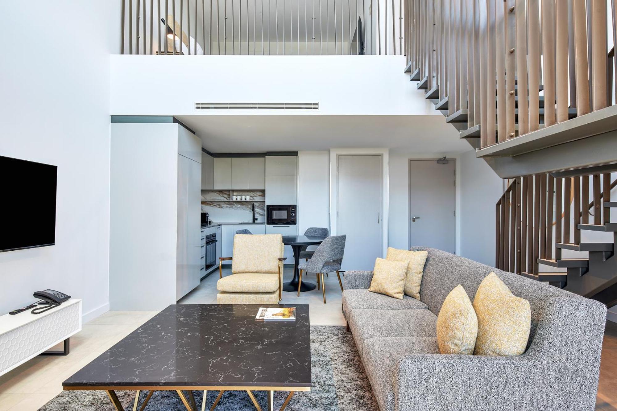Meriton Suites Canberra Exterior photo The interior of a duplex apartment